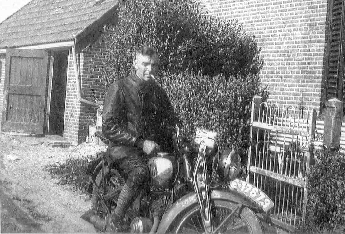 My father at the back of the Riethoeve sitting on his bike which he used to go from farm to farm to inspect and record the number of farm animals born into an ever-changing farm inventory.