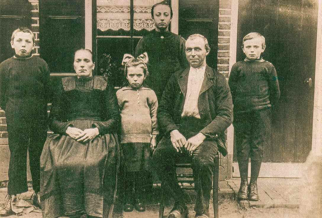 My mother’s family with my mother, the older of the two girls, standing at the back.