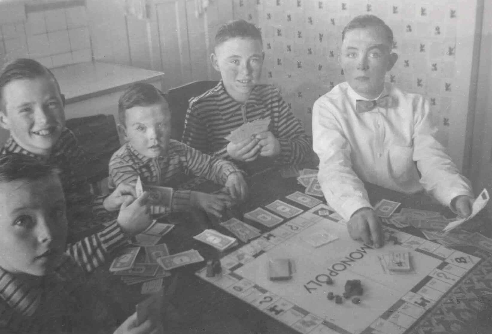 The five brothers playing Monopoly (favourite Sunday past-time) at Agnes St., Wallaceburg. I am the second from the right.